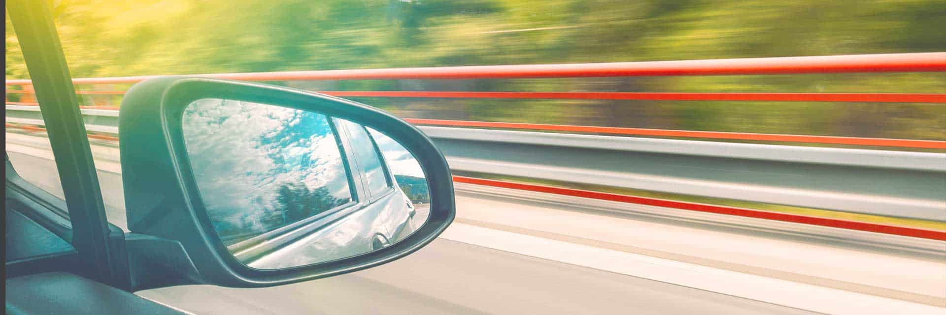 car side mirror driving fast