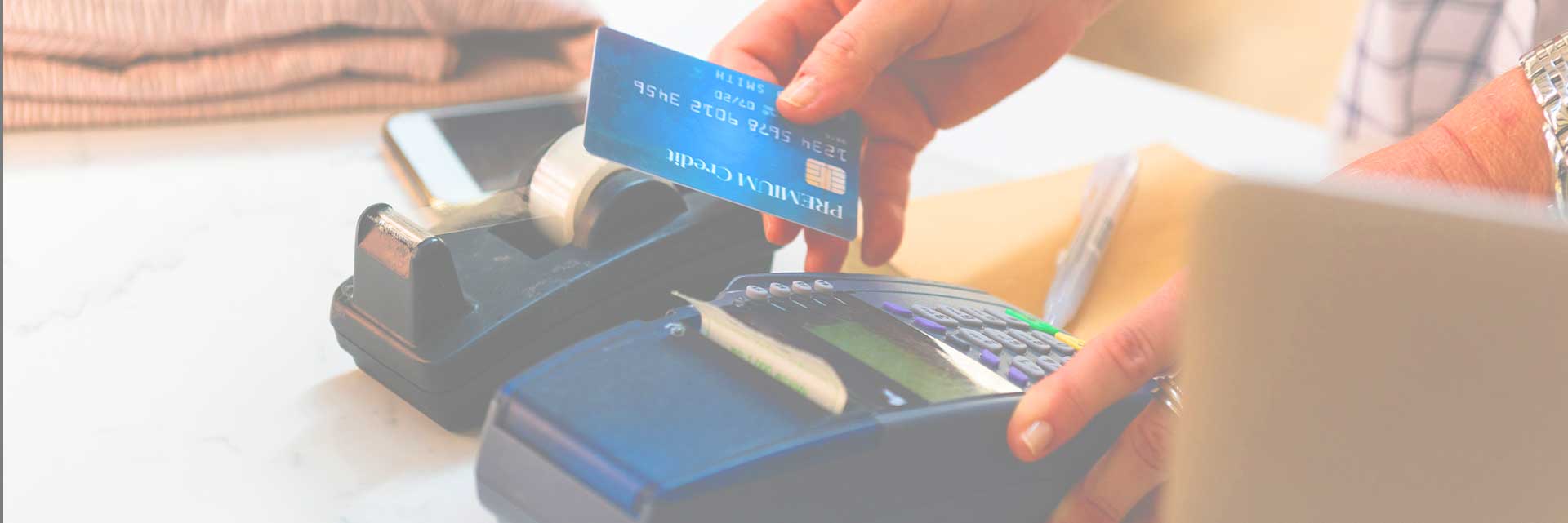 man swiping credit card